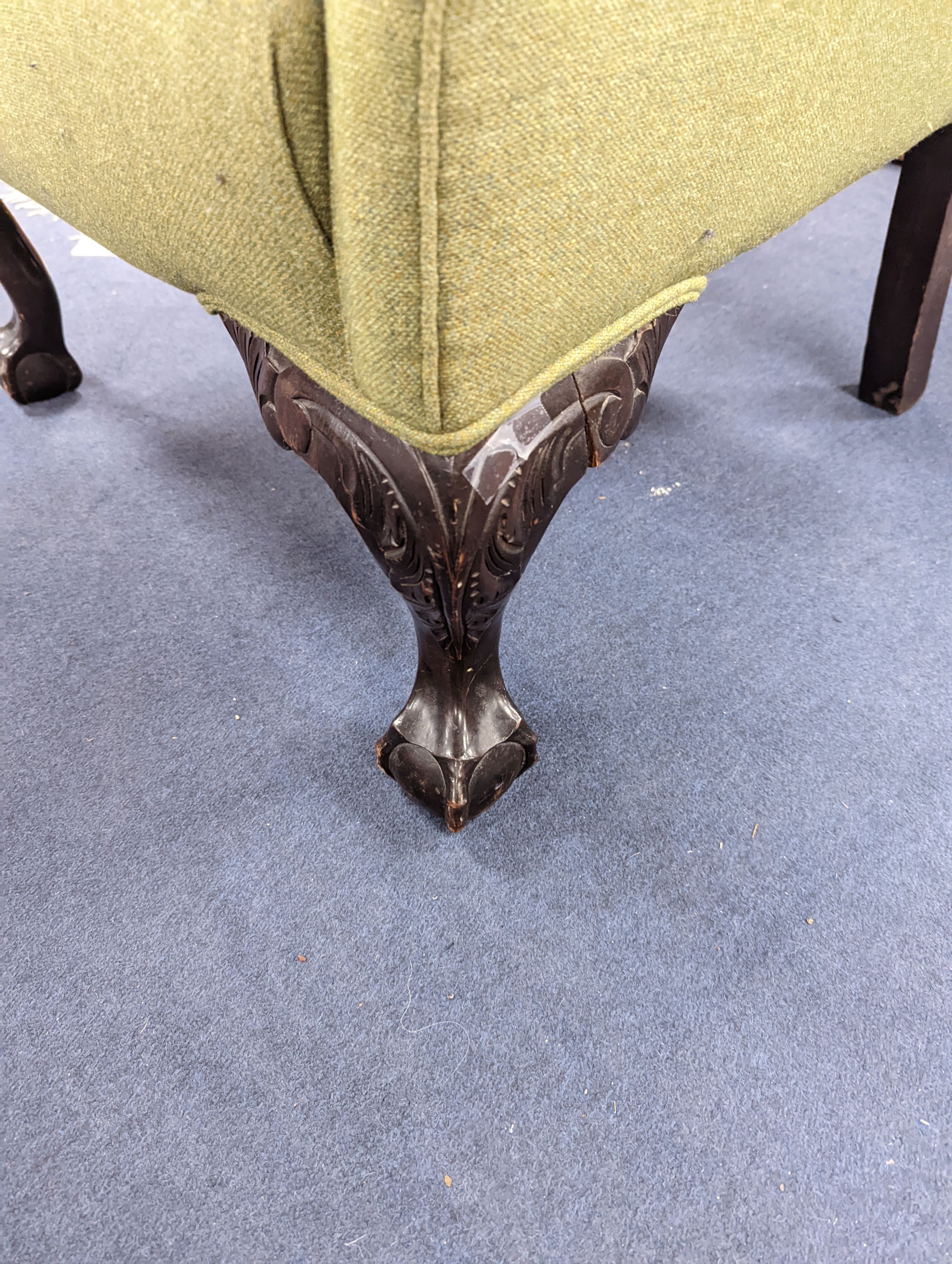A George III style wing armchair upholstered in green wool fabric, width 86cm, depth 80cm, height 111cm